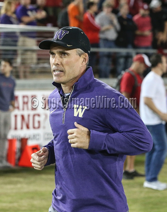 2015StanWash-026.JPG - Oct 24, 2015; Stanford, CA, USA; Washington Huskies head coach Chris Petersen leads the team on the field against the Stanford Cardinal at Stanford Stadium. Stanford beat Washington 31-14.